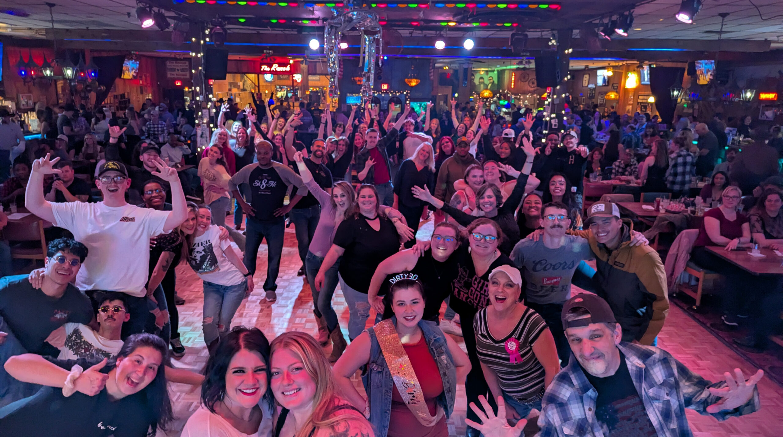 Friends gathered on the Banque dance floor